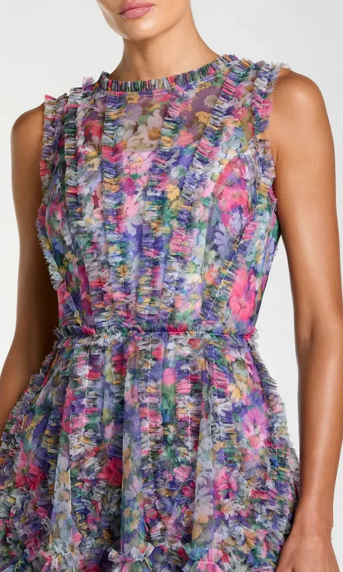A woman wearing the Mac Duggal 8307 high-neck print wedding-guest dress, featuring a colorful floral pattern and ruffled textured details.